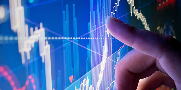 a closeup of a person's finger touching a computer screen displaying a data visualization